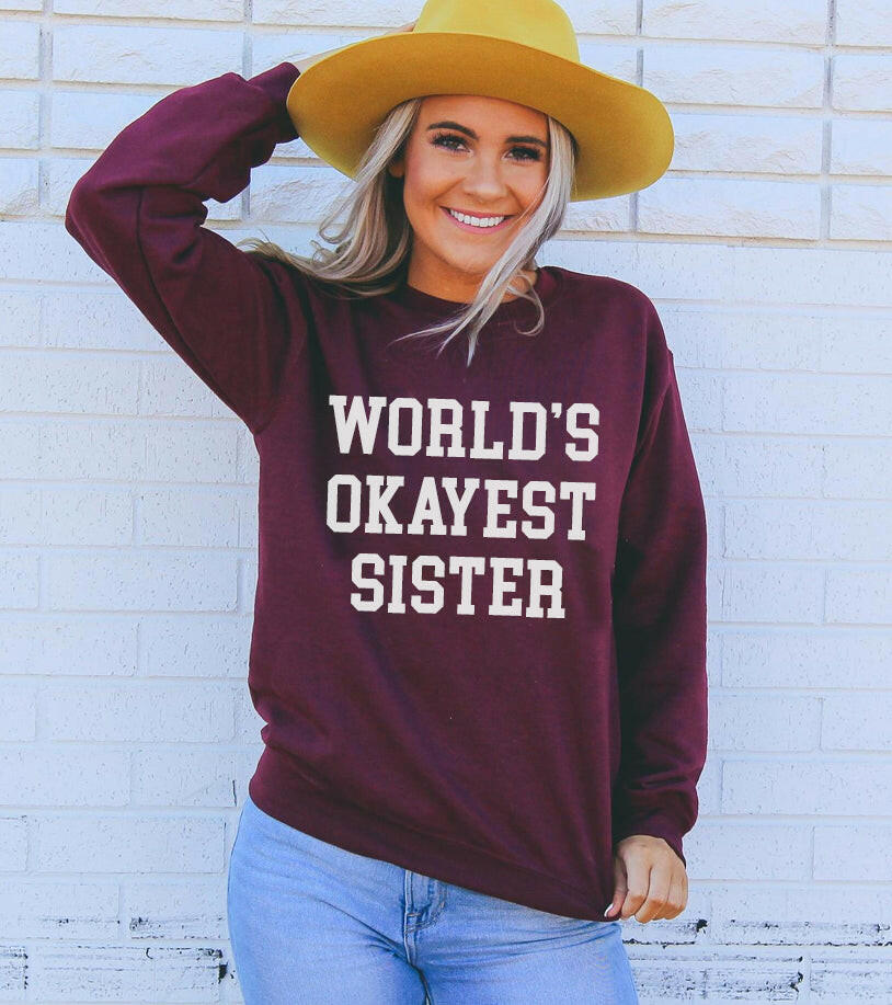 Collection of World's Okayest Sister Sweatshirt in a gallery layout